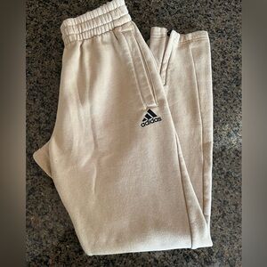 Adidas Adult Small Beige Joggers with zipper at cuff.